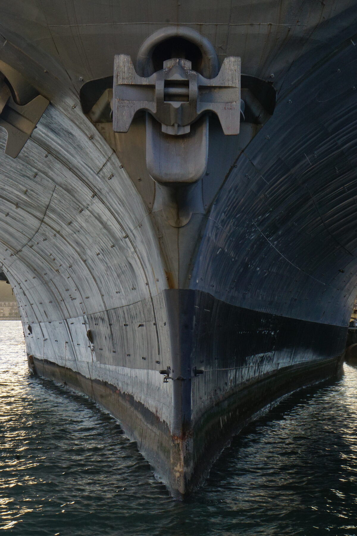 Detail of a ship's bow and anchor mechanism above the water